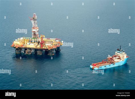 Oil Supply Vessel And Oil Rig High Resolution Stock Photography And