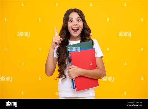 Amazed Teen Girl Teenager School Girl With Books Isolated Studio