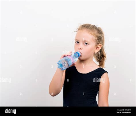 funny baby drinking water from bottle Stock Photo - Alamy