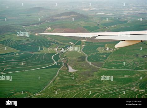 High above the ground. High angle shot of the views from an airplane window Stock Photo - Alamy