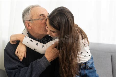 Elderly Eighty Plus Year Old Man With Granddaughter In A Home Setting