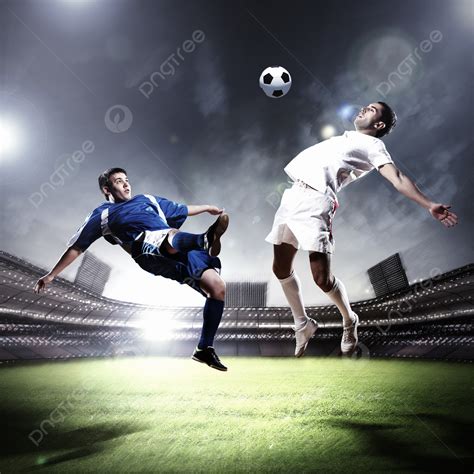 Two Football Players Striking The Ball Football Play Cloudy Photo ...