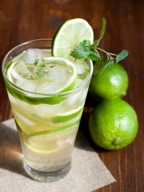 Premium Photo | Mojito with fruit lime mint leaves and ice