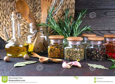 Kitchen Utensils Herbs Colorful Dry Spices In Glass Jars On Dark