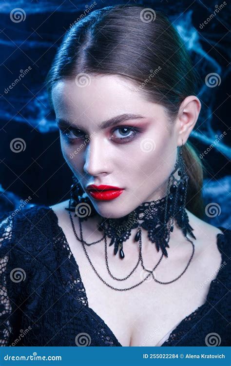 Close Up Of Beautiful Halloween Vampire Woman Portrait On Dark Magic