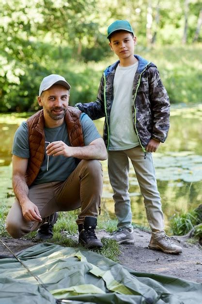 Premium Photo Vertical Full Length Portrait Of Father And Son Setting