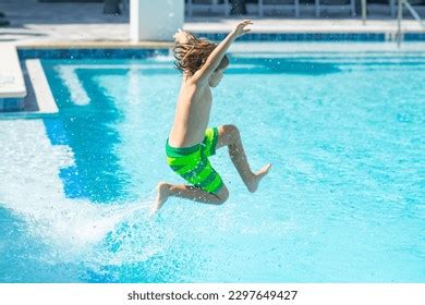 Kid Jumping On Swiming Pool Photos, Images and Pictures