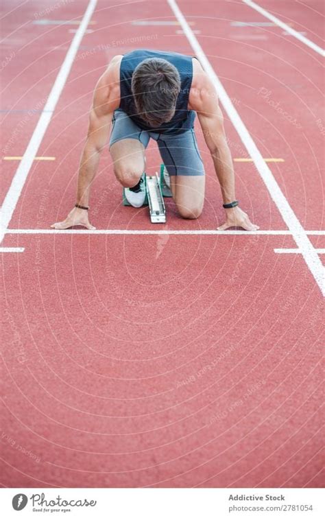 Anonymous sportsman on crouch start - a Royalty Free Stock Photo from ...