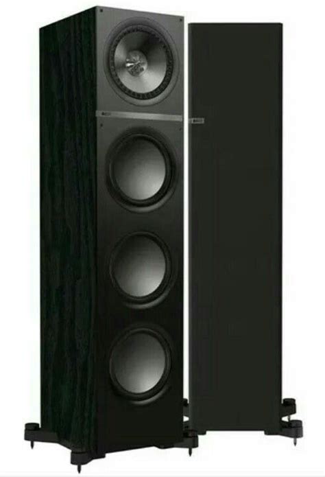 Two Black Speakers Sitting Side By Side On Top Of Each Other In Front