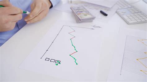 Male hand analyzing currency chart. Male hand analyzing dollar chart