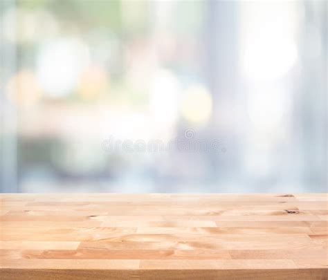 Empty Wood Table Top On Blur Abstract Window Glass View Stock Image