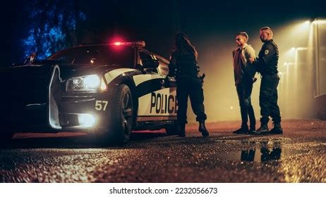 Two Police Officers Arrest Suspect Put Stock Photo 2232056673 | Shutterstock