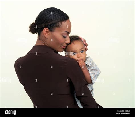 Woman Holding Baby Stock Photo Alamy