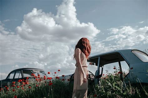 Young Woman In A Poppy Field And Abandoned Car By Stocksy Contributor Jovana Rikalo Stocksy