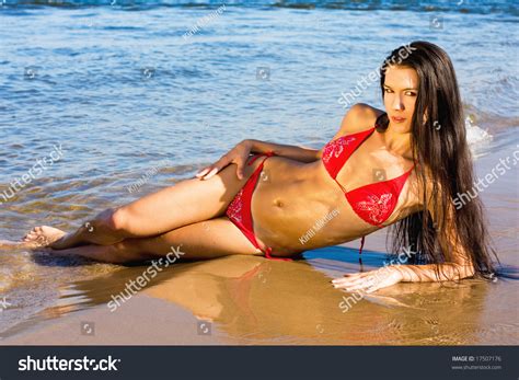 Outdoor Portrait Of A Beautiful Young Sexy Woman In Red Bikini At The