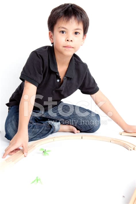 Boy Building With Colorful Wooden Blocks Stock Photo | Royalty-Free ...