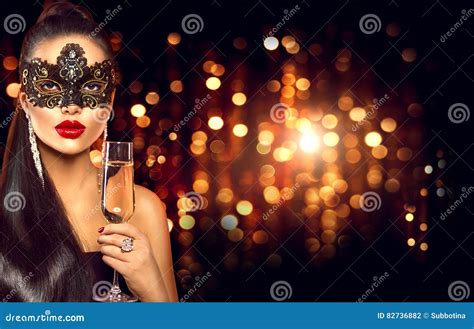 Woman With Glass Of Champagne Wearing Venetian Masquerade Mask Stock