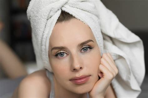 Beauty Portrait Of A Cheerful Attractive Woman With A Towel On Her Head