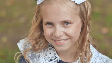 Portrait Of A Smiling 13 Year Old Blonde Girl Face Close Up Stock