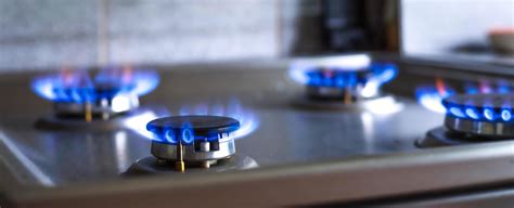 Close Up Of A Blue Fire From A Kitchen Stove 4 Gas Burners With A Burning Flame Economy