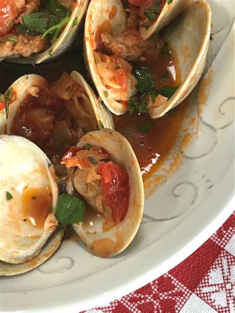 Clams With Spicy Sausage In Garlicky Tomato Broth Proud Italian Cook