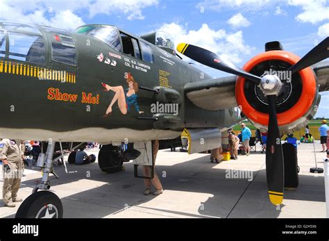 A World War II era B-25 light bomber with nose art displayed at an ...