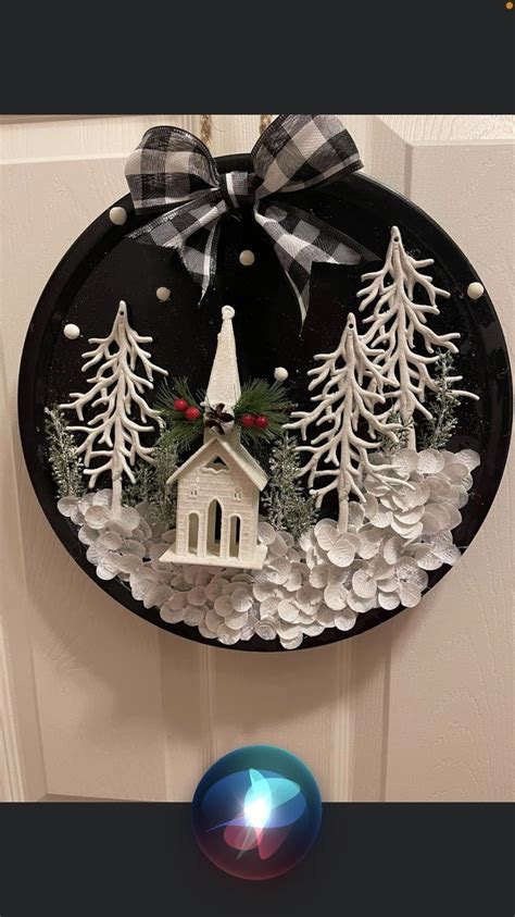 A Door Hanger With A Church And Evergreen Trees On It Decorated With