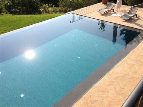 Infinity swimming pool with waterfall by INDALO PISCINE | Pool ...