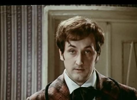 a man in a suit and tie looking at the camera with an intense look on ...