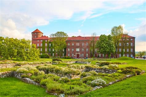 The Courtyard Is Buried In Flowers And Greenery In The Ancient Zamek