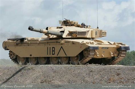 an army tank is sitting on the ground