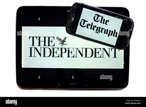 The Logos Of The Independent And The Telegraph Newspapers Displayed On