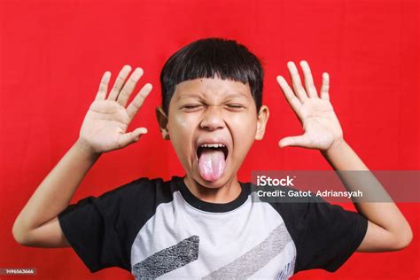 Little Kid Sticking Out His Tongue Stock Photo - Download Image Now - 10-11 Years, Asia ...