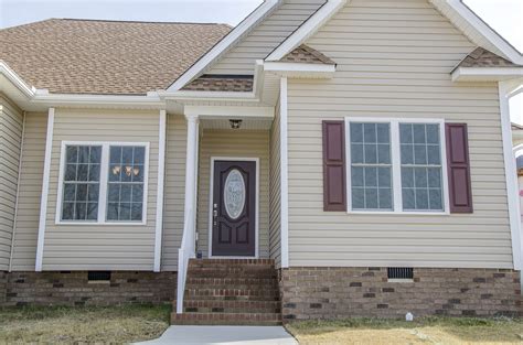 Custom Home With Beautiful Curbappeal Love The Tan Siding With Burgundy Shutters And