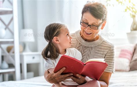 Grandmother Reading A Book Stock Photo By Choreograph Photodune