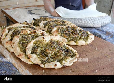 Stack Of Traditional Palestinian Food Called Manakish Consisting Of Dough Topped With Olive Oil