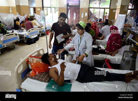 Dengue Fever Patients Lying On The Bed Outside The Shaheed Suhrawardy