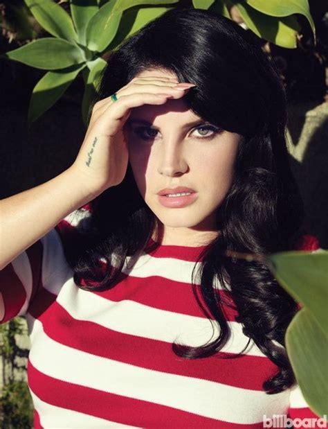 A Woman With Long Black Hair Wearing A Red And White Striped Shirt Is