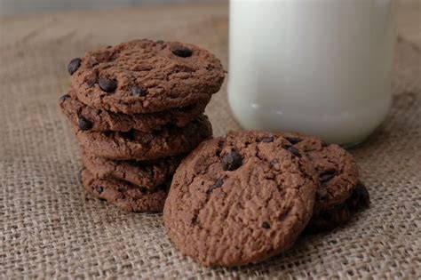 Premium Photo Close Up Of Cookies And Milk On Table