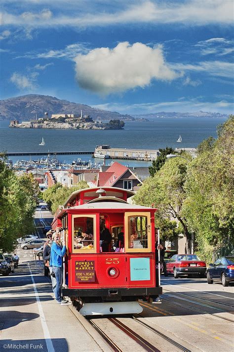 Iconic Red Cable Car with Stunning View of Alcatraz Island