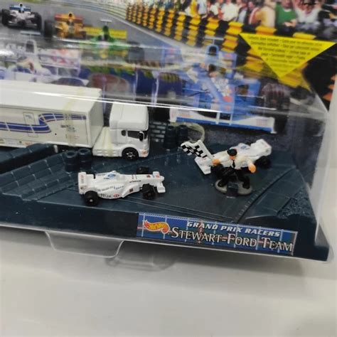 HOT WHEELS Planet Micro Ford Stewart F Team Nuovo Sigillato Gran Premio Racers EUR