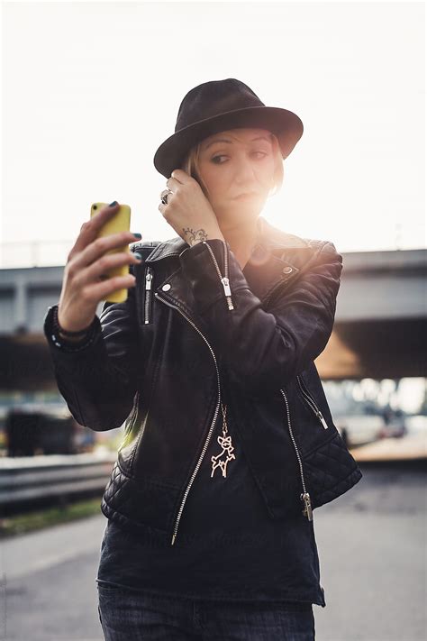 A Woman Taking A Selfie With Her Mobile Phone By Stocksy Contributor Mauro Grigollo Stocksy