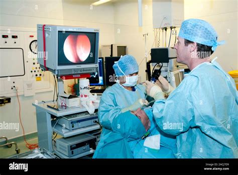 Nasal Polyp Surgery Surgeon Using Endoscopic Tools To Excise A Polyp