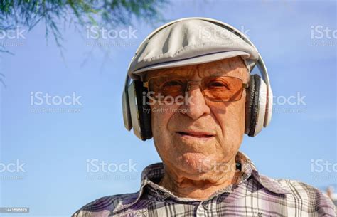 Portrait Of A Retired Gentleman With Music Headphones Occupational