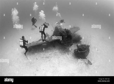 Diver Over Fighter Plane Next To USS Saratoga Bikini Atoll Marshall Islands Micronesia Stock