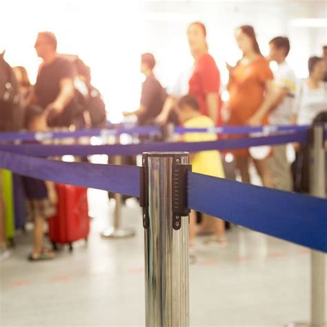 People Are Standing In Line At An Airport