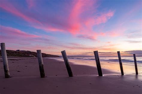 A Beautiful Sunset at Moana Beach with the Wooden Posts Seperating the ...