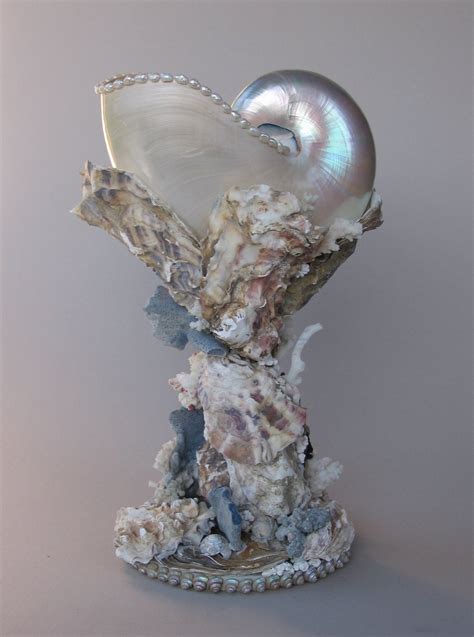 Bebemoon A Mother Of Pearl Nautilus Shell Held On A Stand Of