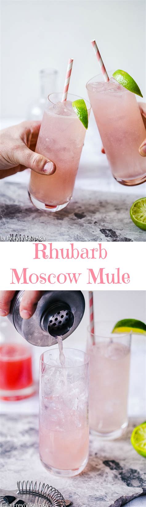 Two Glasses Filled With Pink Lemonade And Limes On Top Of A Marble Table