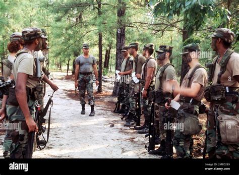 An Instructor Inspects Newly Camouflaged Recruits During Basic Training Base Fort Jackson